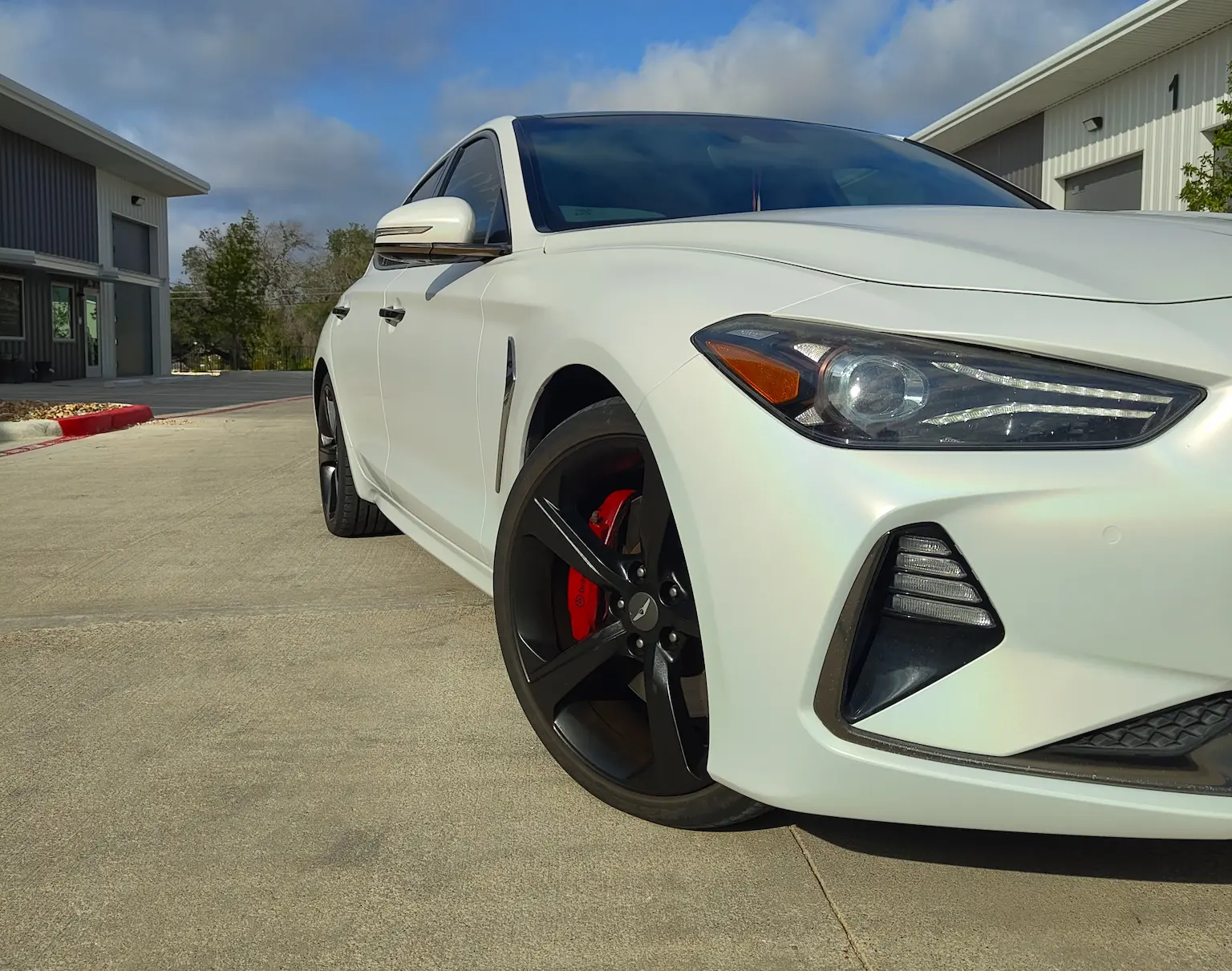 Satin ghost pearl wrap on a Genesis G70 — Austin TX
